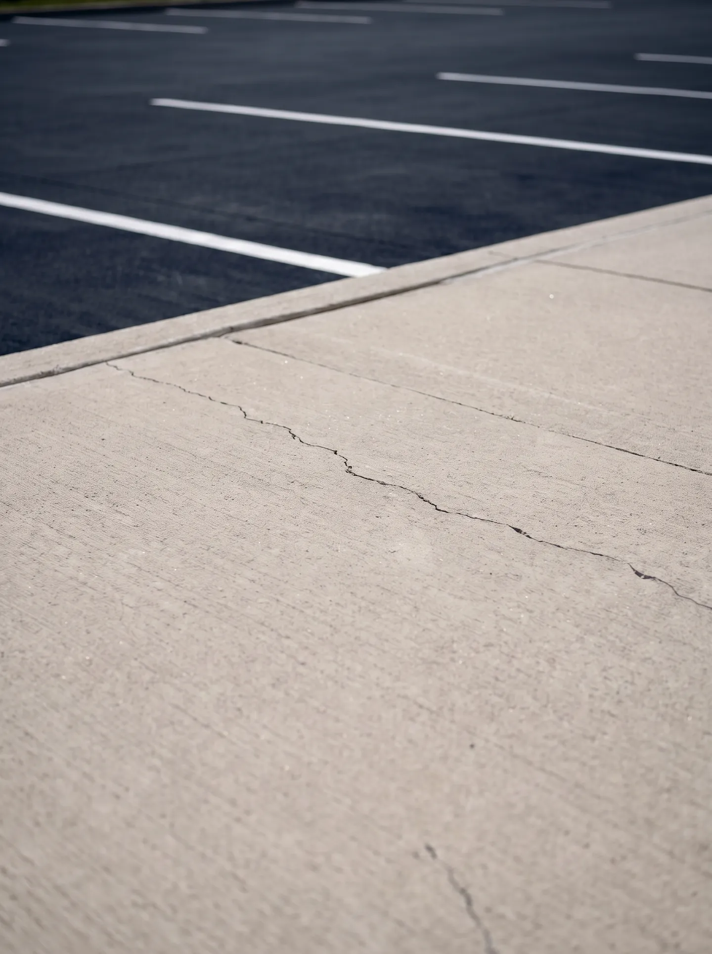 Cracked commercial concrete sidewalk trip hazard