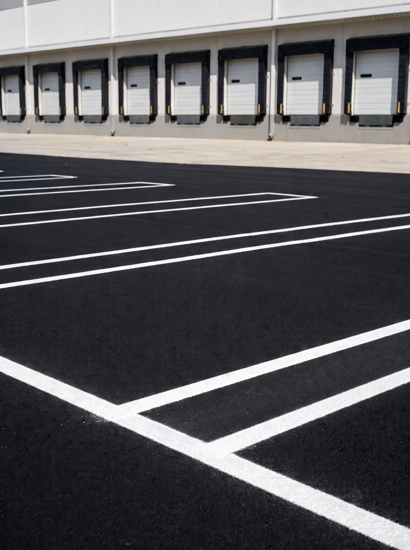 Freshly striped heavy-duty industrial parking lot in Sanford, FL